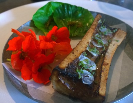 Roasted Bone Marrow with Cabbage and Nasturtium Flowers